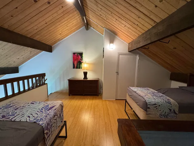 a bed room with a bed and a couch