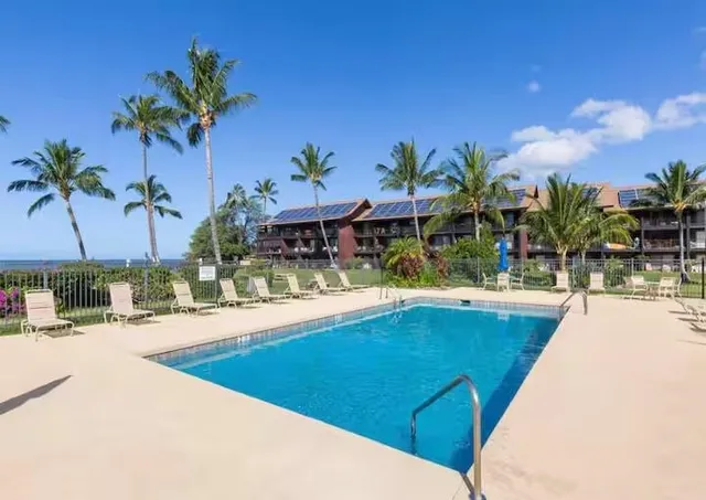 a view of a swimming pool and lounge chair