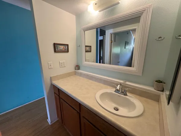 a bathroom with a sink double vanity and a mirror