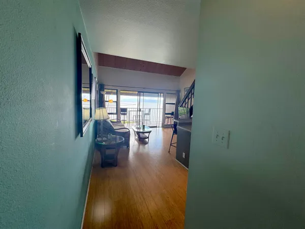 a view of a living room and dining room
