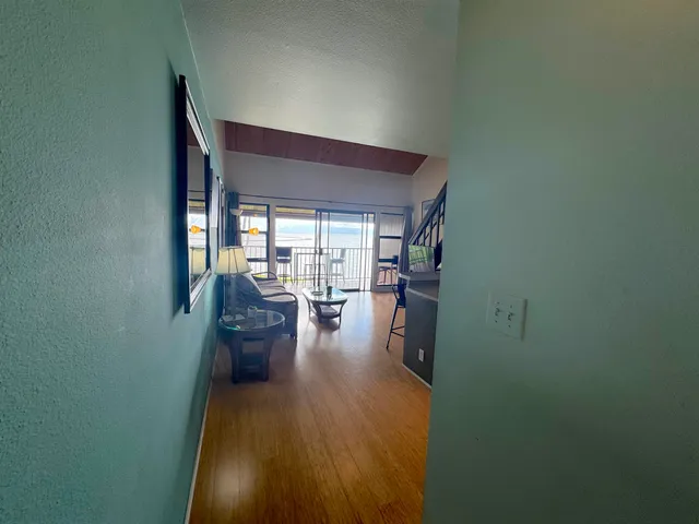 a view of a living room and dining room