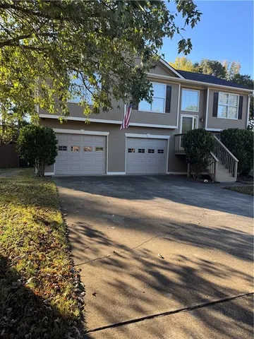 a house view with a garden space