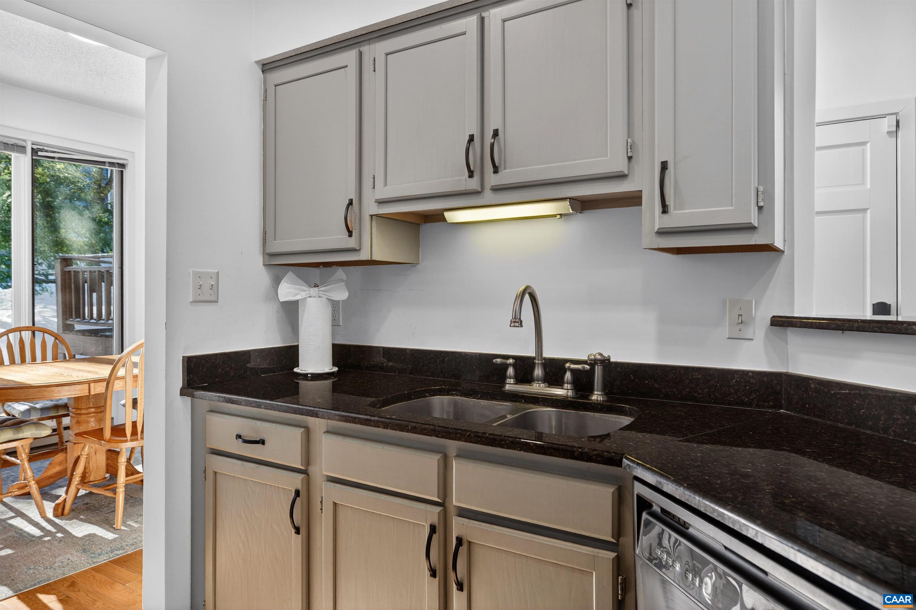 22 Trillium Cl Roseland, VA 22967 - Photo 12 of 35 a kitchen with granite countertop white cabinets and a sink