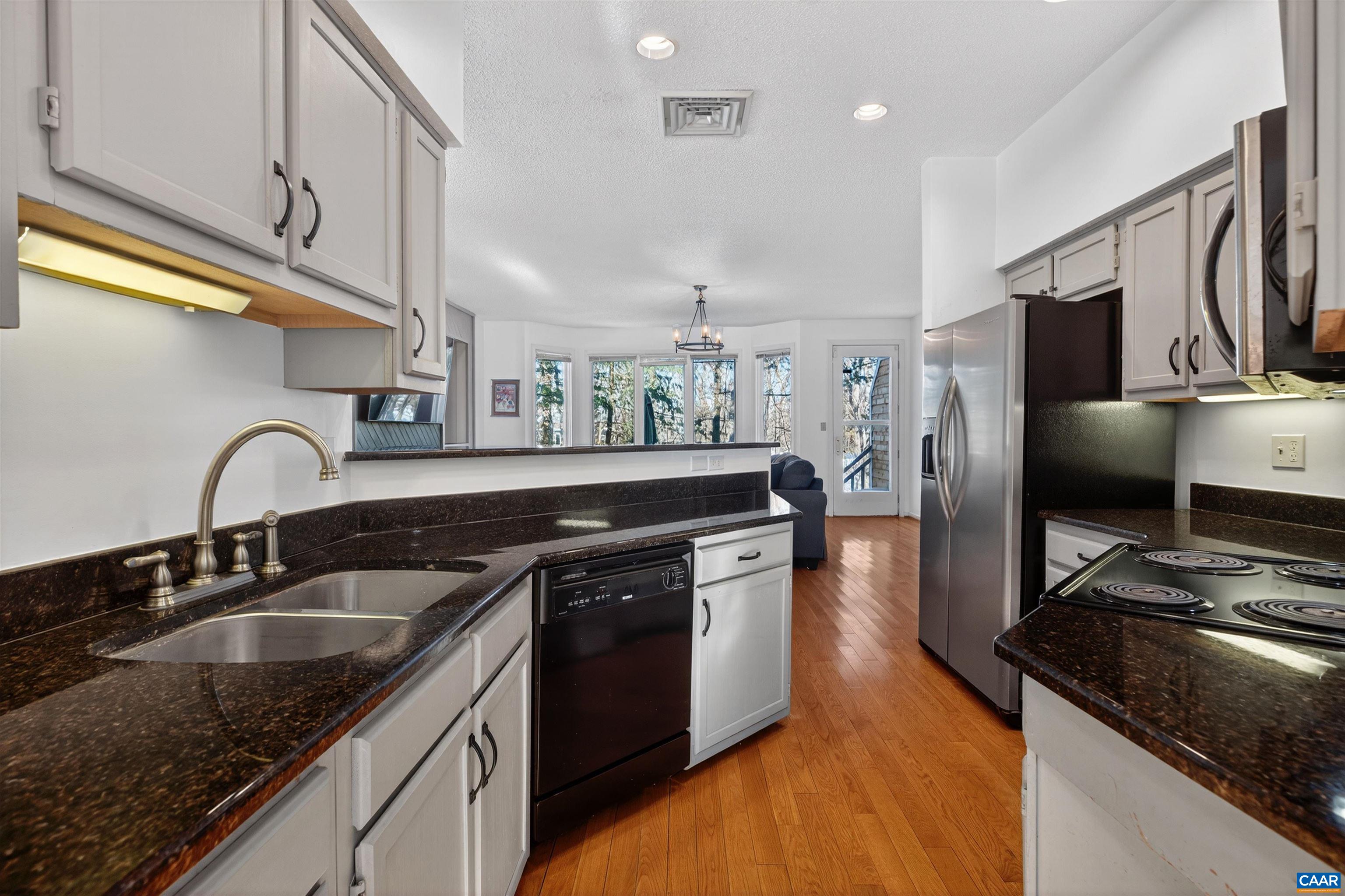 22 Trillium Cl Roseland, VA 22967 - Photo 13 of 35 a kitchen with stainless steel appliances granite countertop a sink stove and refrigerator