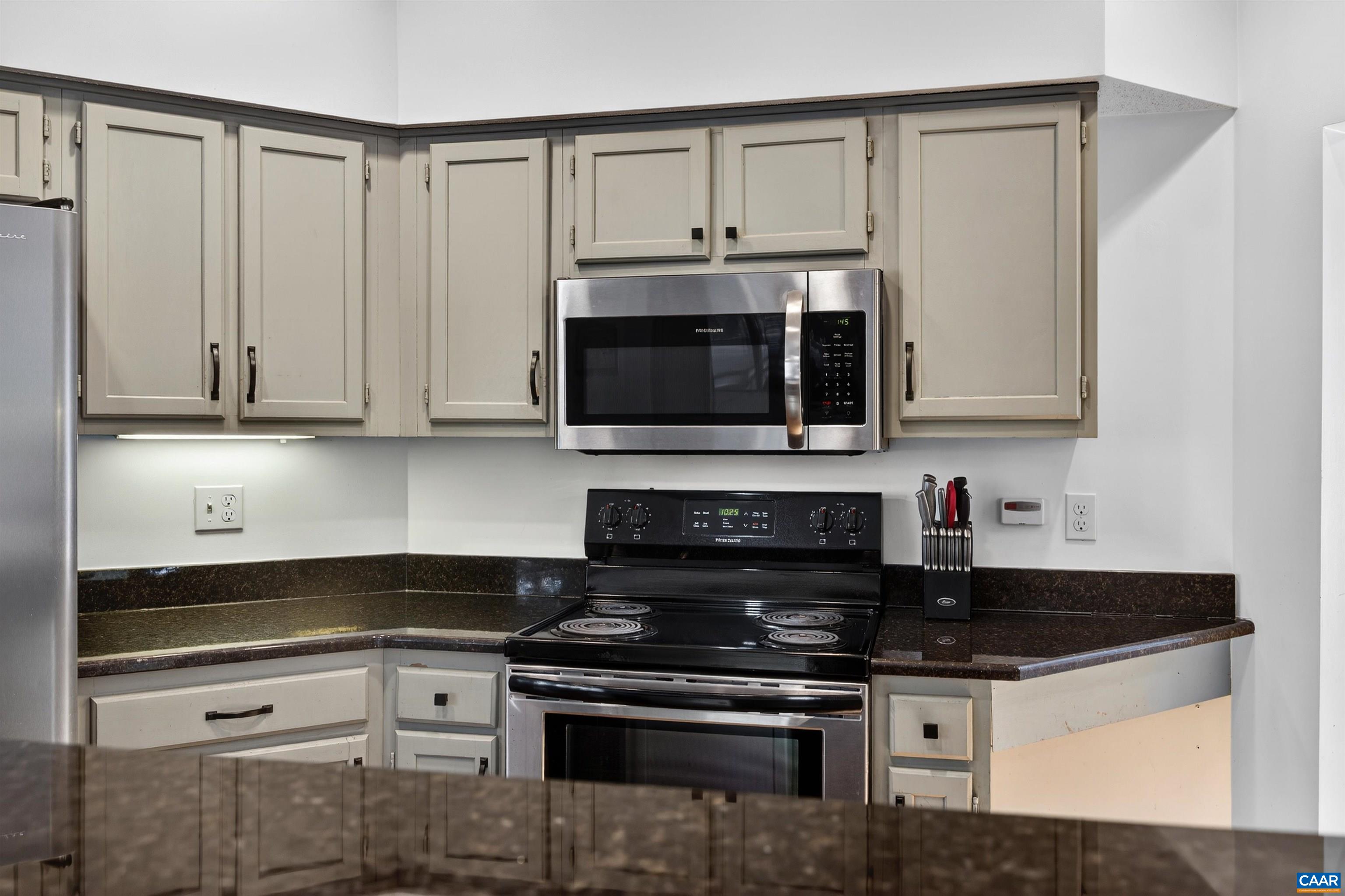 22 Trillium Cl Roseland, VA 22967 - Photo 14 of 35 a kitchen with stainless steel appliances granite countertop a stove and a microwave
