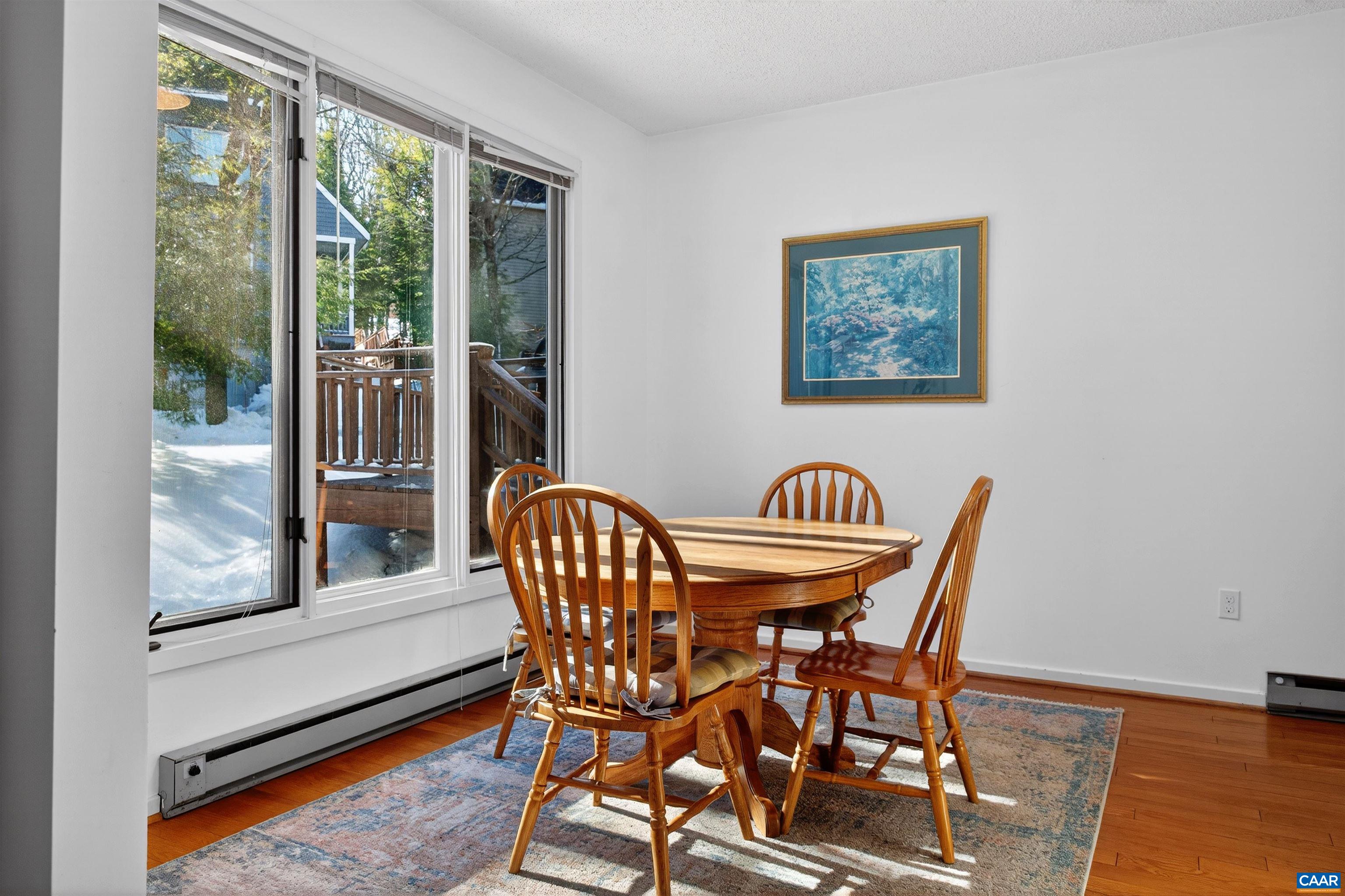 22 Trillium Cl Roseland, VA 22967 - Photo 16 of 35 a view of a dining room with furniture window and wooden floor