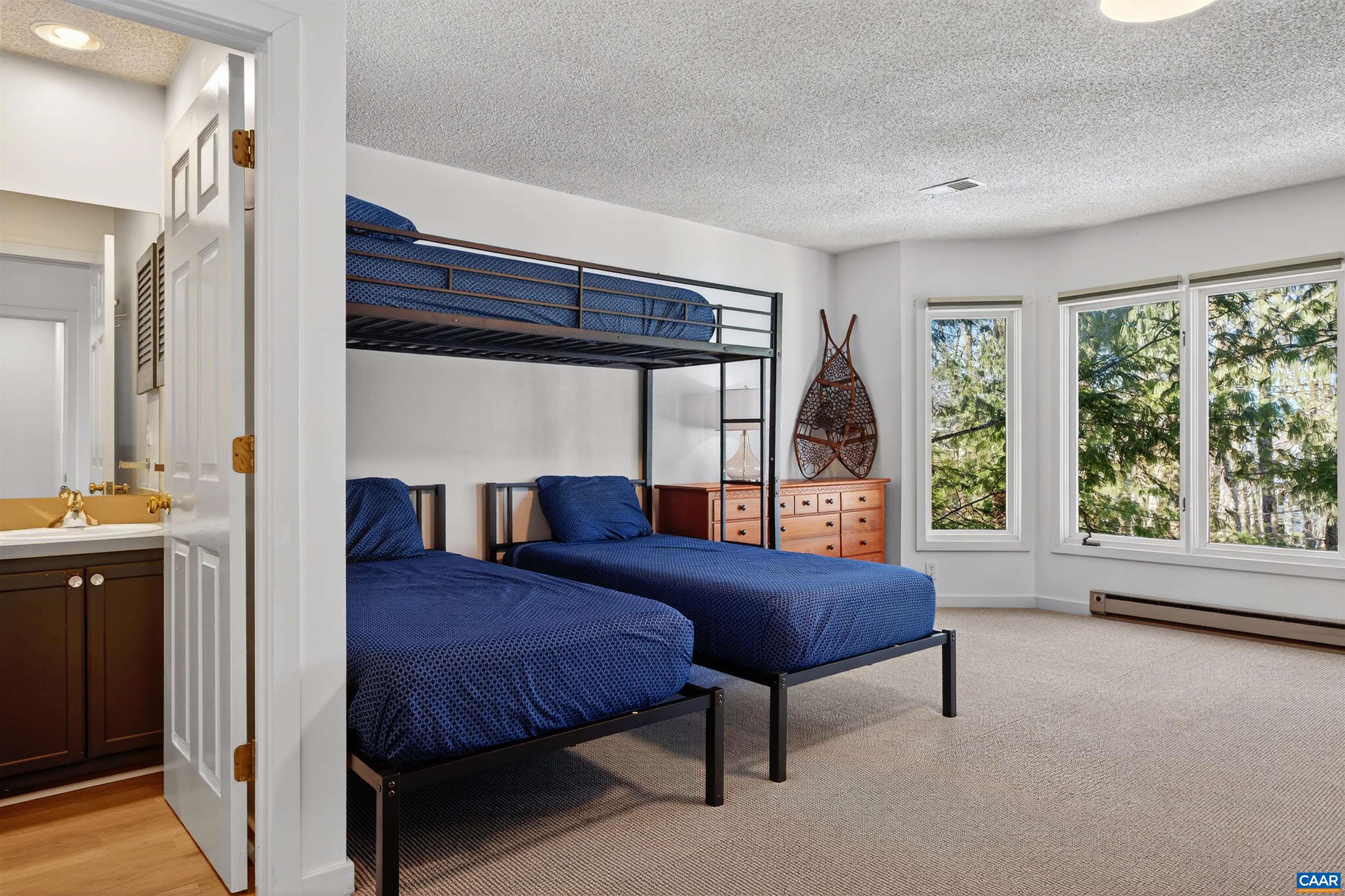 22 Trillium Cl Roseland, VA 22967 - Photo 19 of 35 a bedroom with a bed and a large window with balcony view