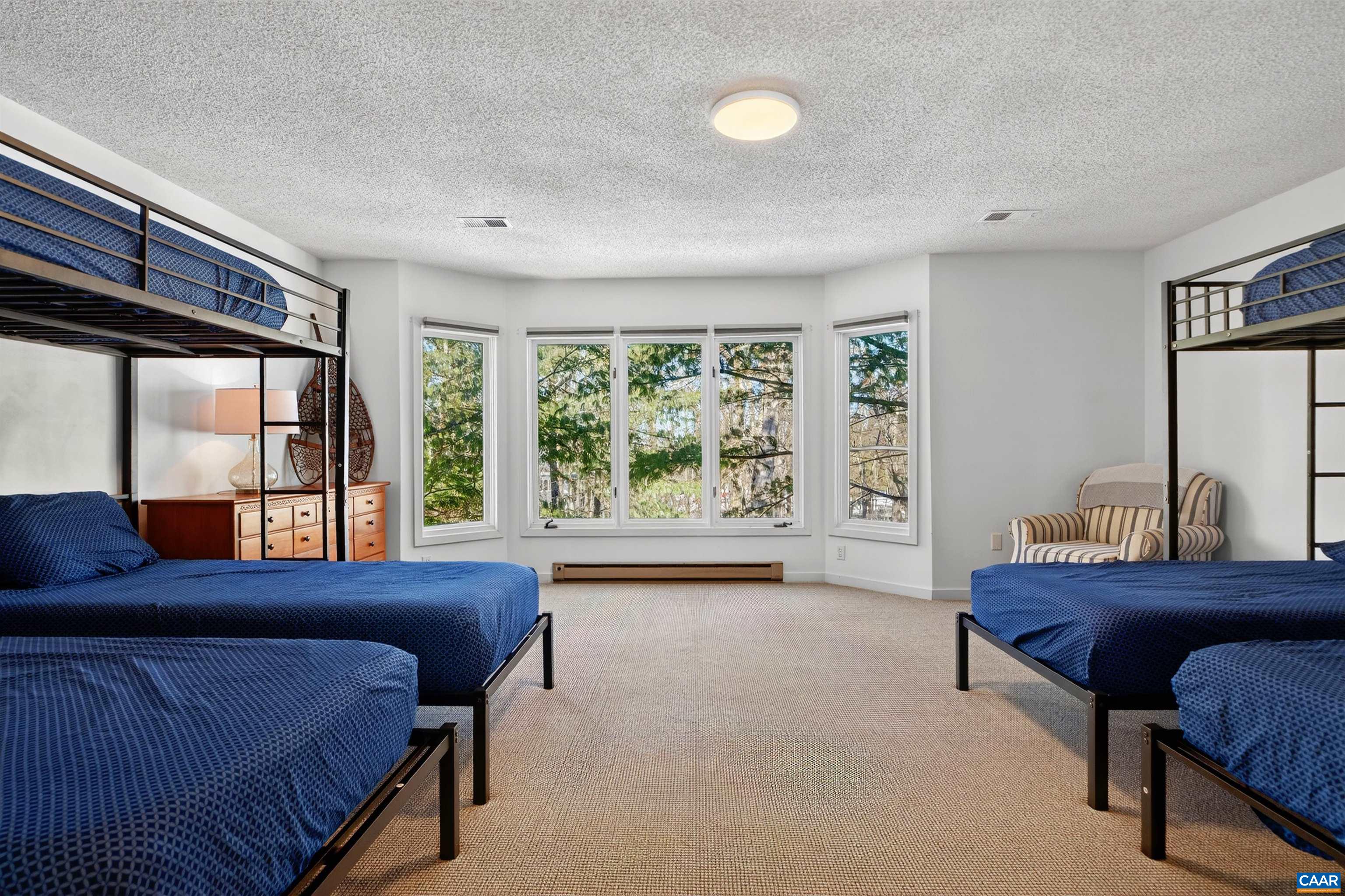 22 Trillium Cl Roseland, VA 22967 - Photo 20 of 35 a bedroom with a large bed and a large window