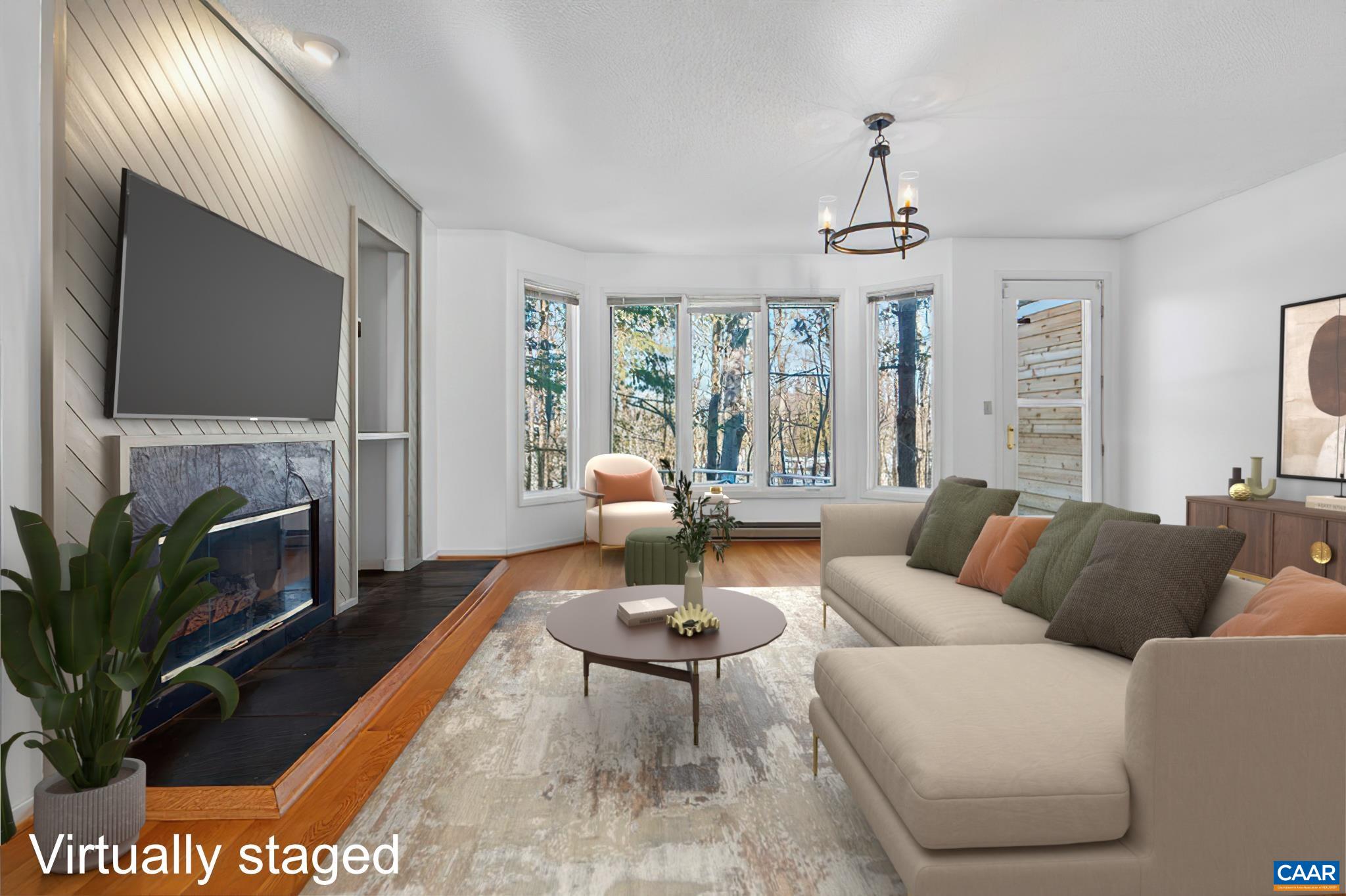 22 Trillium Cl Roseland, VA 22967 - Photo 2 of 35 a living room with furniture a fireplace and a flat screen tv