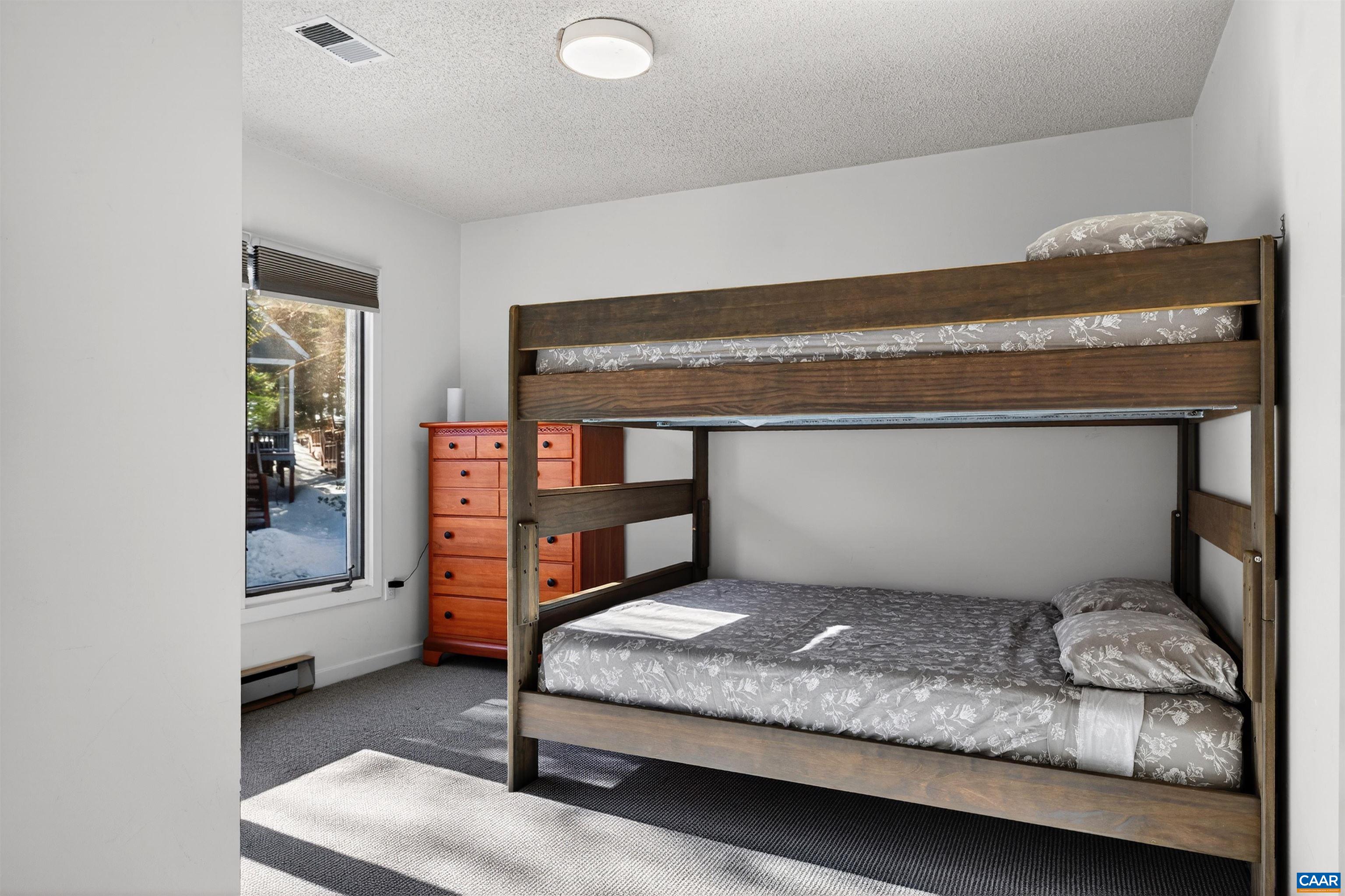 22 Trillium Cl Roseland, VA 22967 - Photo 26 of 35 a bedroom with a bed and dresser