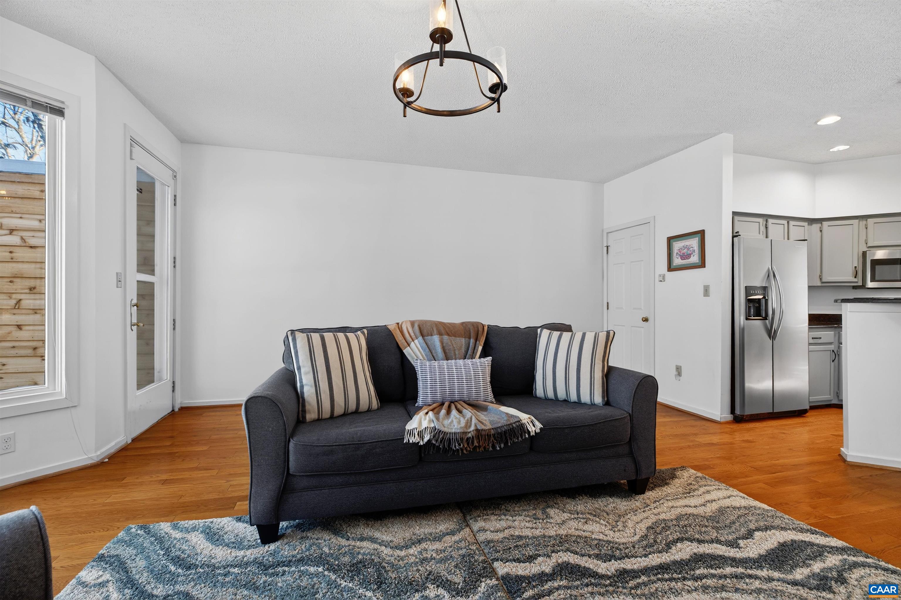 22 Trillium Cl Roseland, VA 22967 - Photo 6 of 35 a living room with furniture wooden floor and a rug