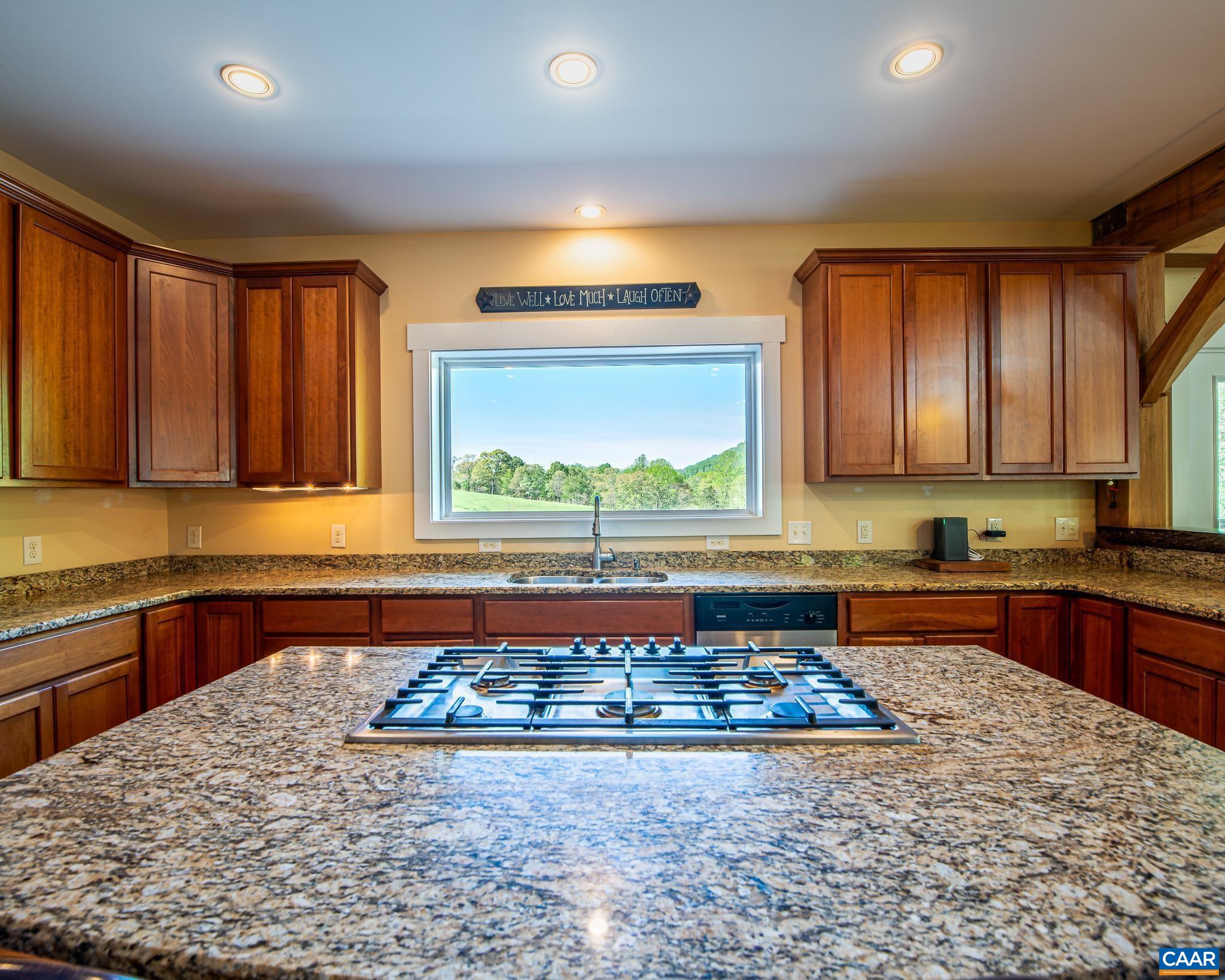 1671 Dudley Mountain Road Charlottesville, VA 22903 - Photo 10 of 60 a large kitchen with kitchen island granite countertop a sink and a stove