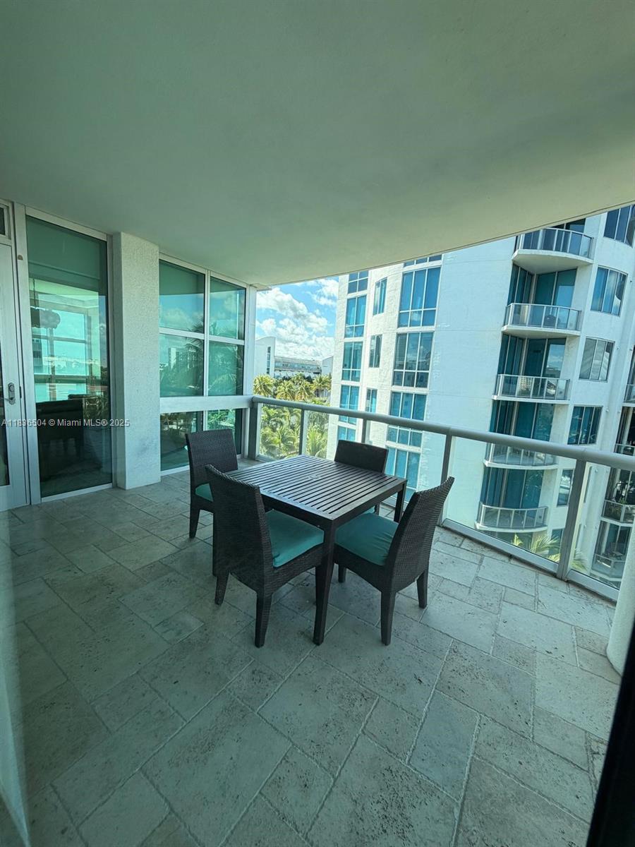3131 Northeast 188th Street, Unit 1808 Aventura, FL 33180 - Photo 18 of 72 a view of a dining room with furniture and a rug