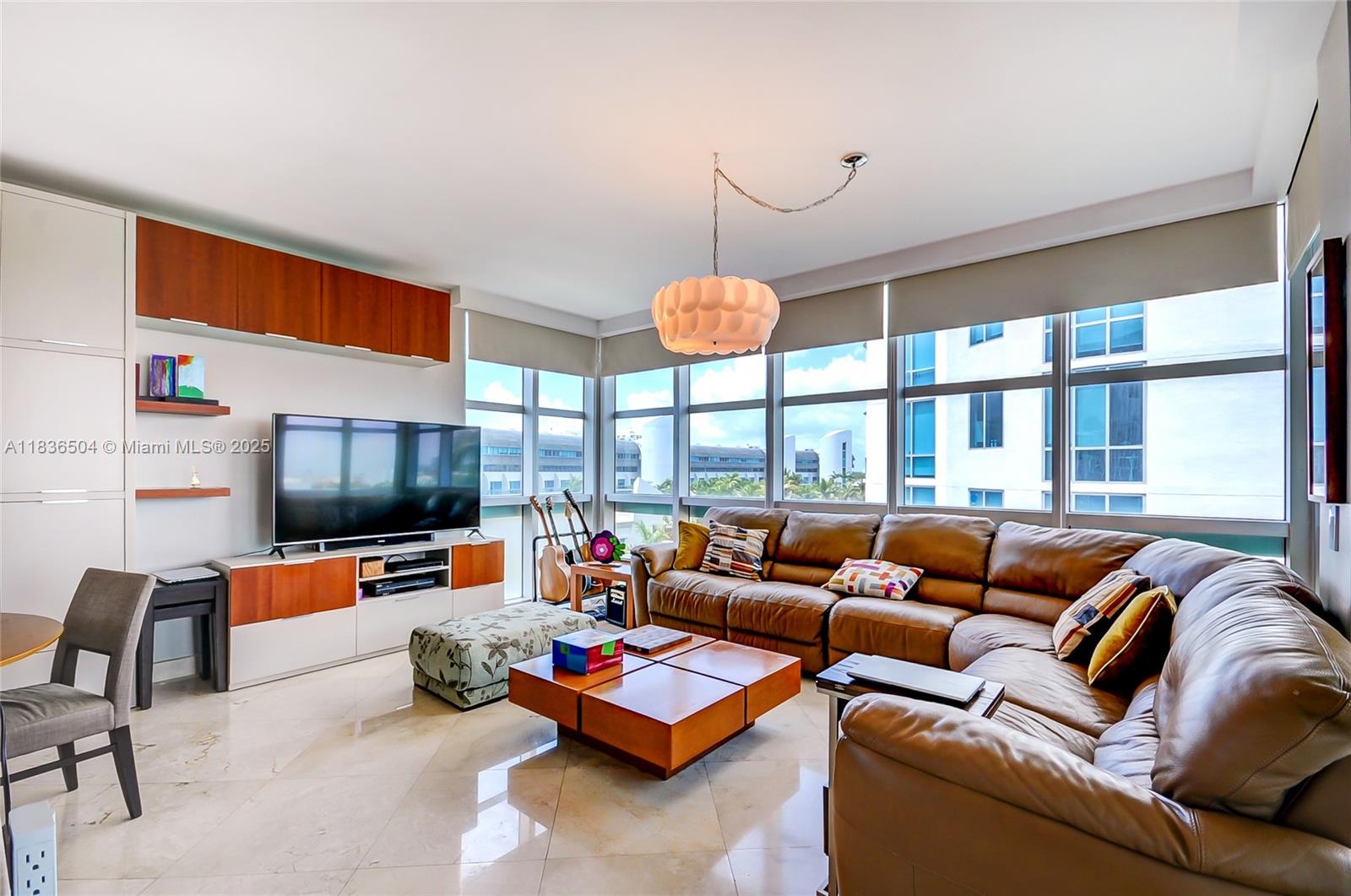 3131 Northeast 188th Street, Unit 1808 Aventura, FL 33180 - Photo 2 of 72 a living room with furniture kitchen view and a large window