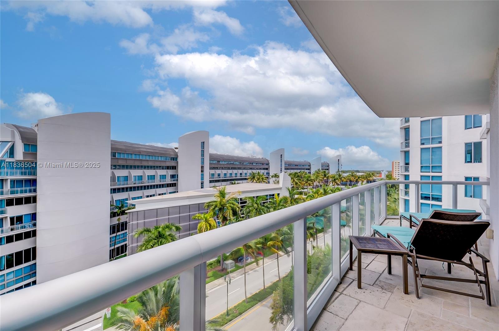 3131 Northeast 188th Street, Unit 1808 Aventura, FL 33180 - Photo 21 of 72 a view of a city from a balcony with outdoor seating