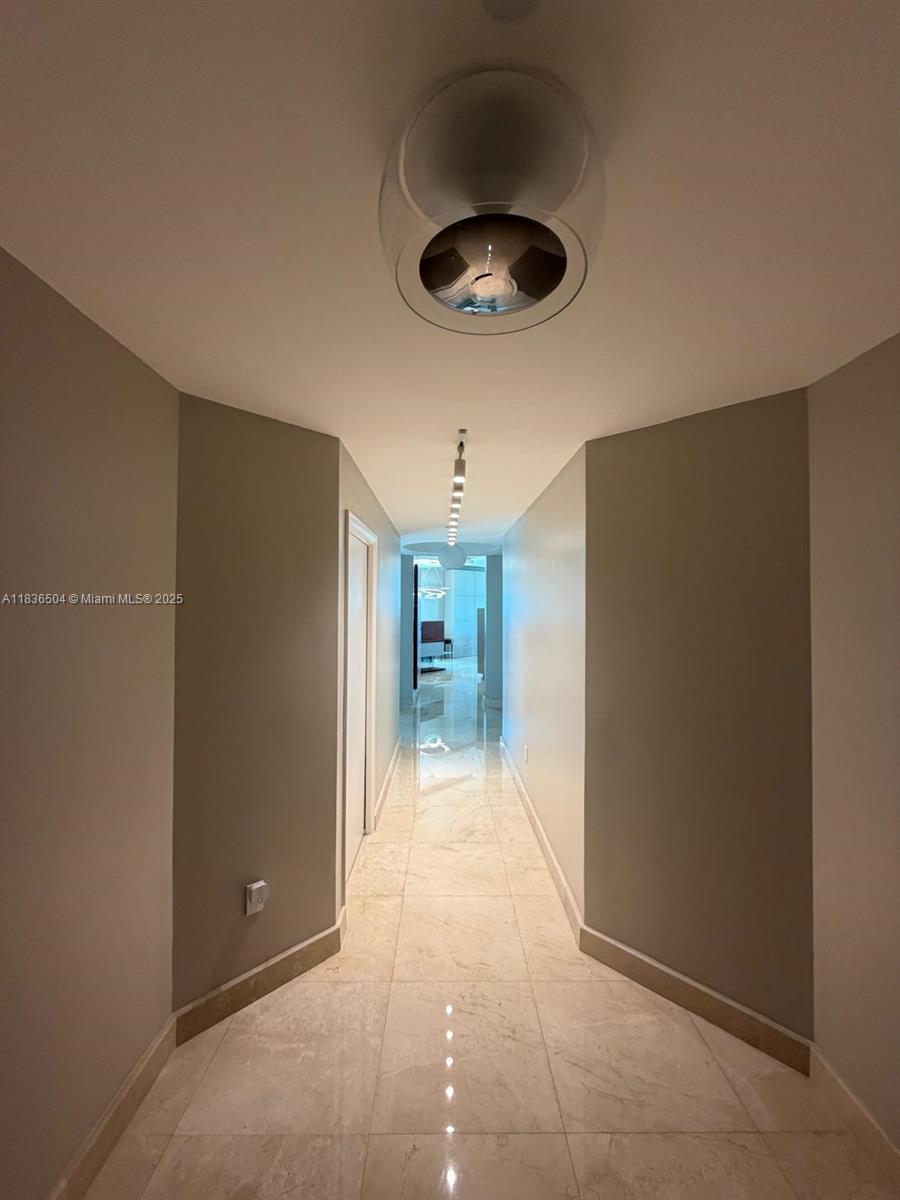 3131 Northeast 188th Street, Unit 1808 Aventura, FL 33180 - Photo 29 of 72 a view of a hallway to a bedroom