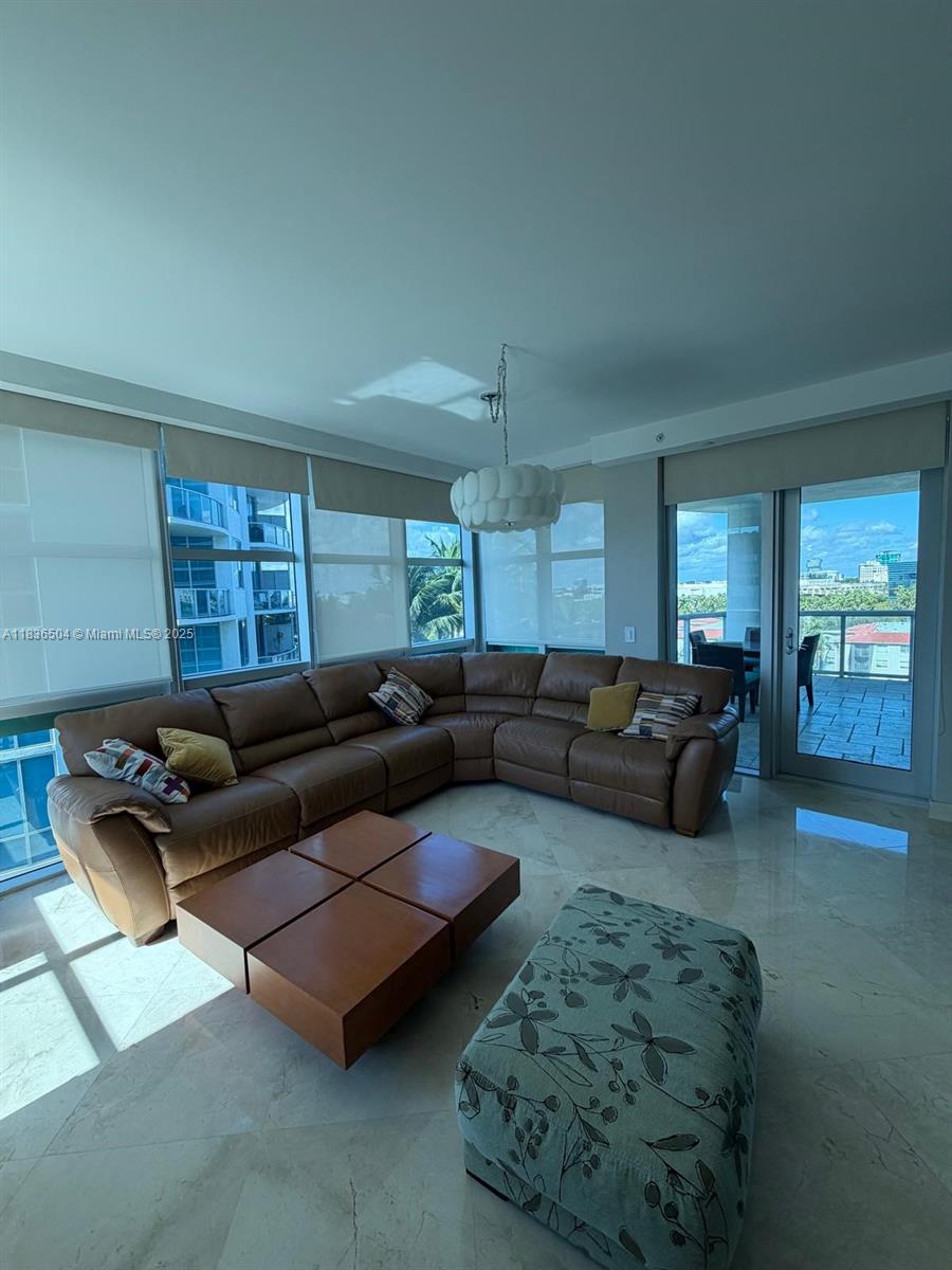 3131 Northeast 188th Street, Unit 1808 Aventura, FL 33180 - Photo 3 of 72 a living room with furniture rug and window
