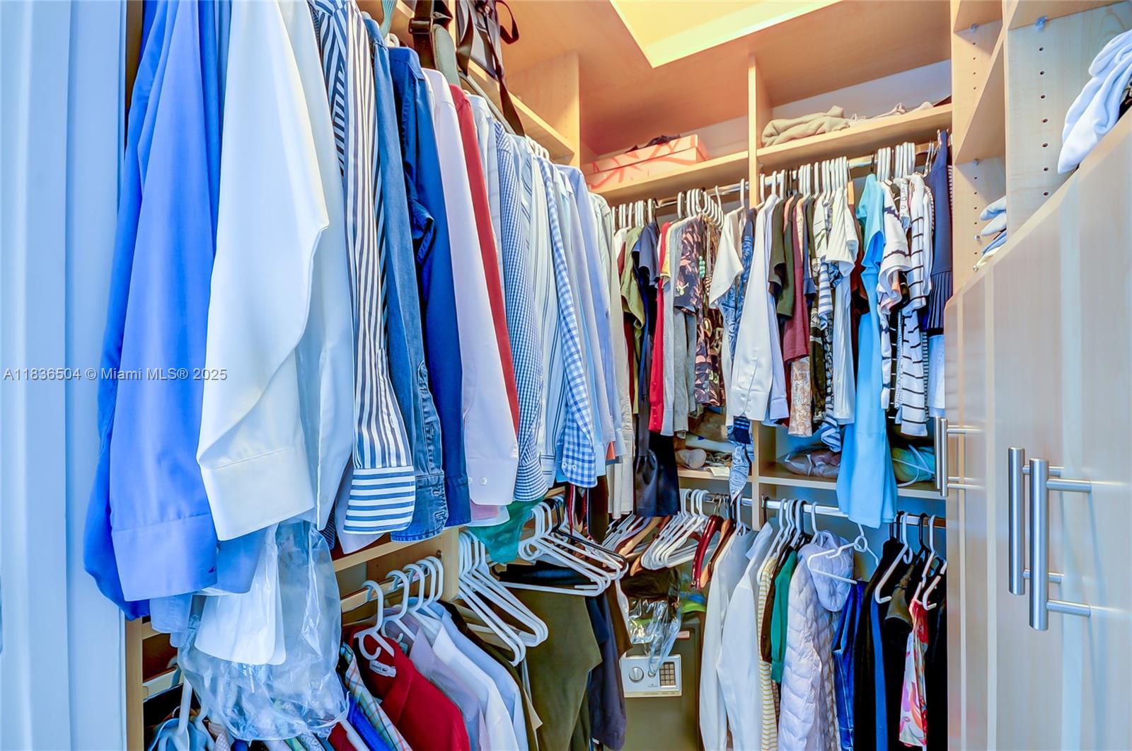 3131 Northeast 188th Street, Unit 1808 Aventura, FL 33180 - Photo 38 of 72 a view of walk in closet with clothes