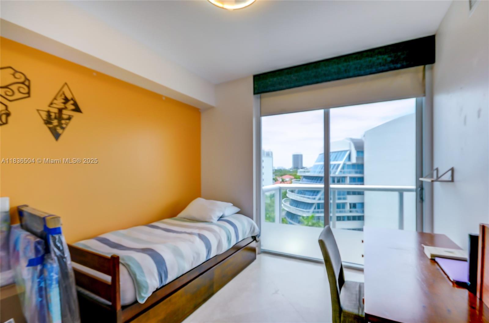 3131 Northeast 188th Street, Unit 1808 Aventura, FL 33180 - Photo 41 of 72 a bedroom with a bed and a large window