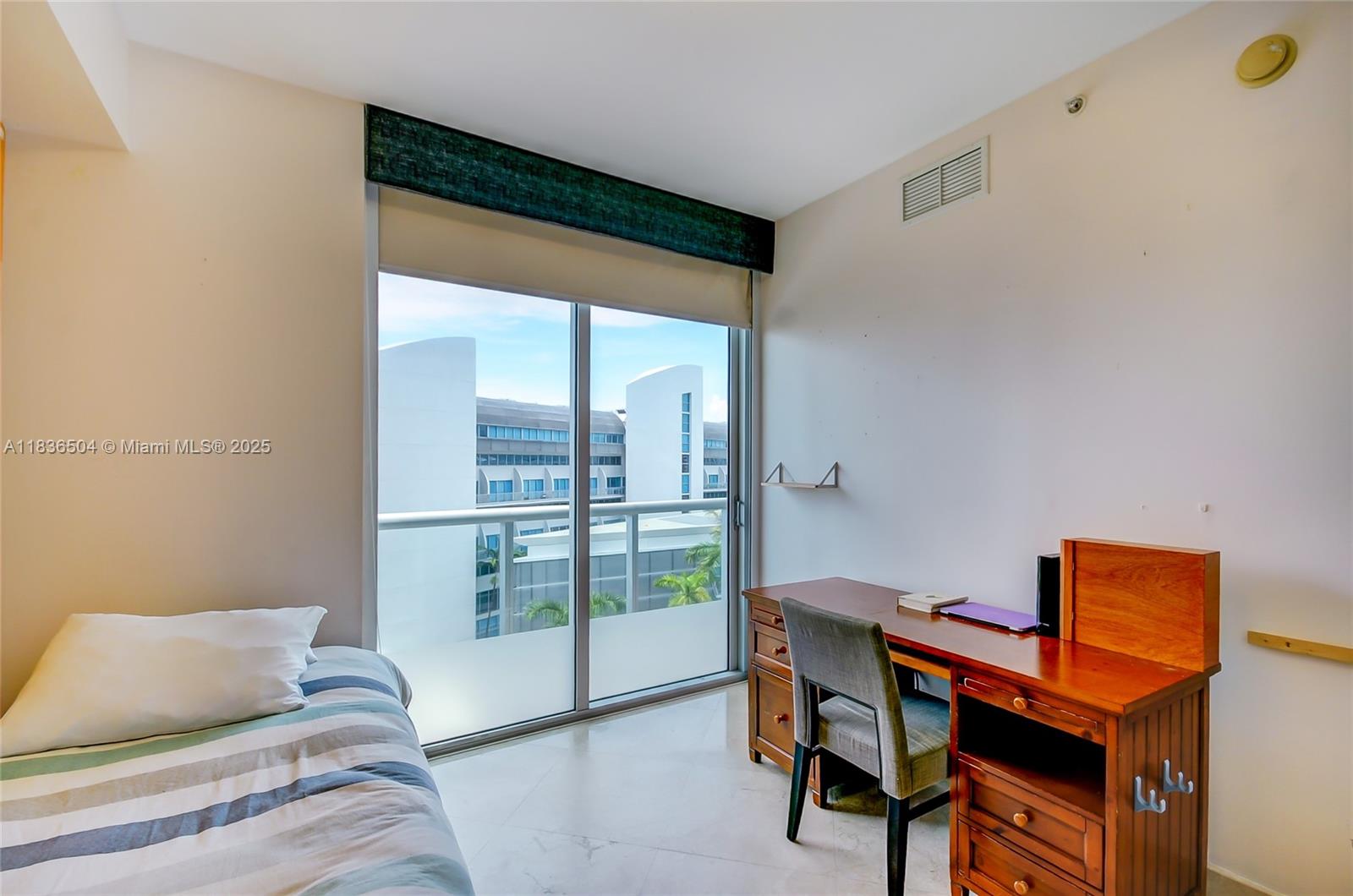 3131 Northeast 188th Street, Unit 1808 Aventura, FL 33180 - Photo 42 of 72 a living room with furniture and a floor to ceiling window