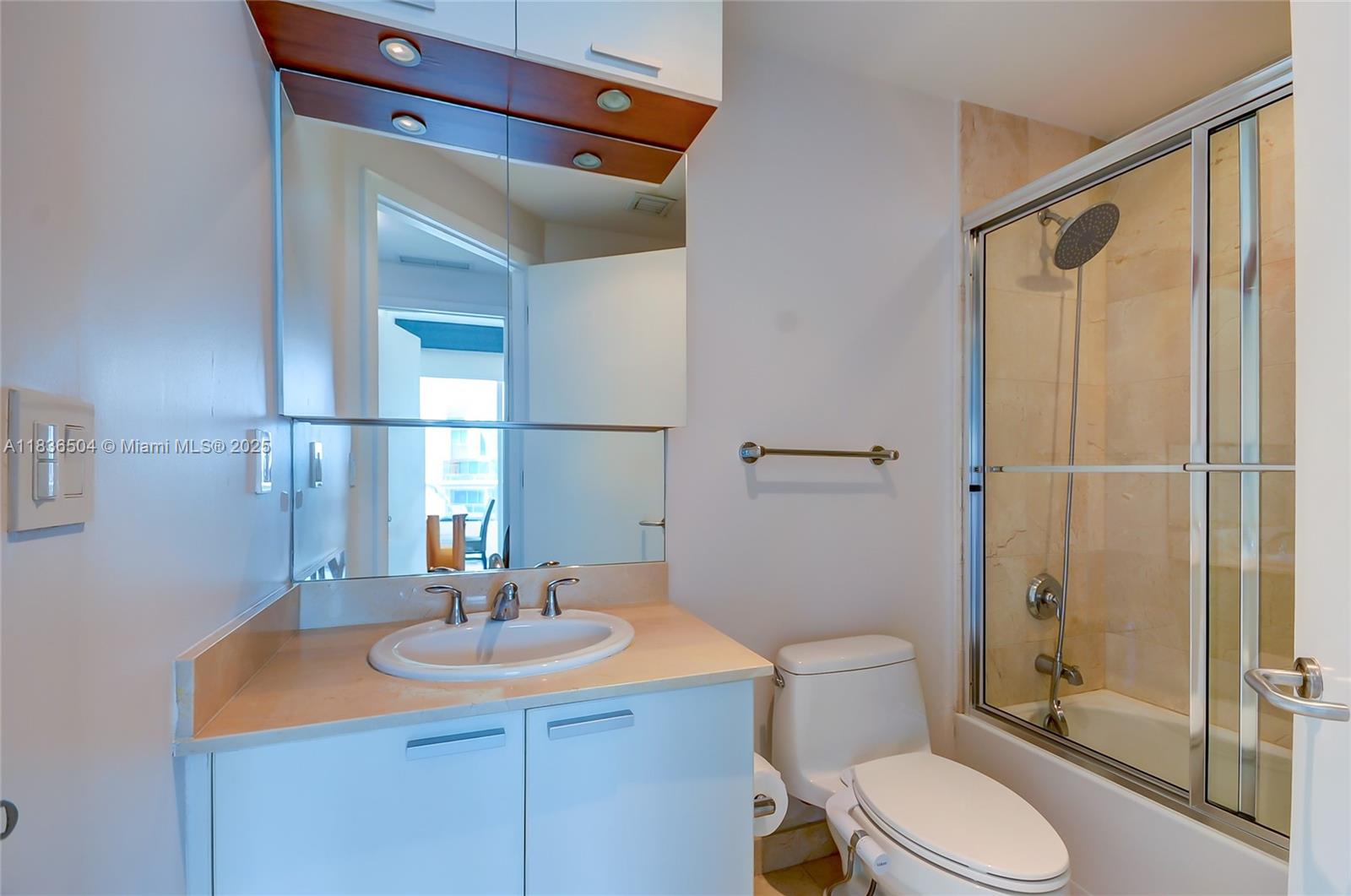 3131 Northeast 188th Street, Unit 1808 Aventura, FL 33180 - Photo 43 of 72 a bathroom with a sink toilet and shower
