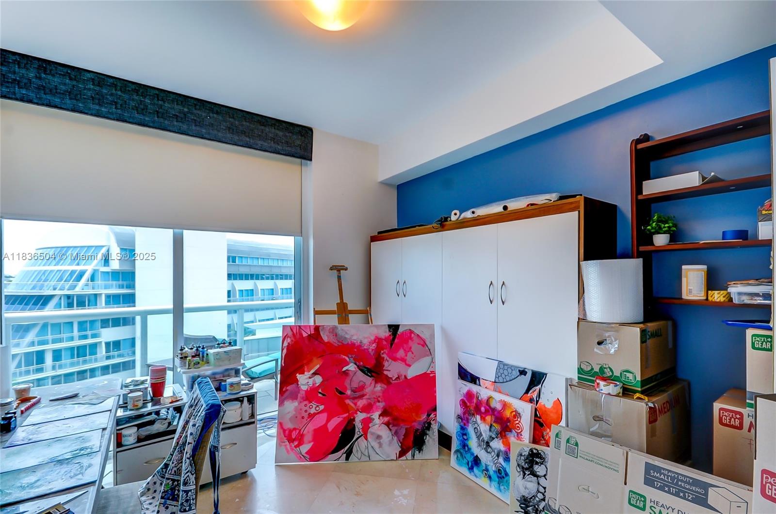 3131 Northeast 188th Street, Unit 1808 Aventura, FL 33180 - Photo 44 of 72 a bedroom with furniture and a window