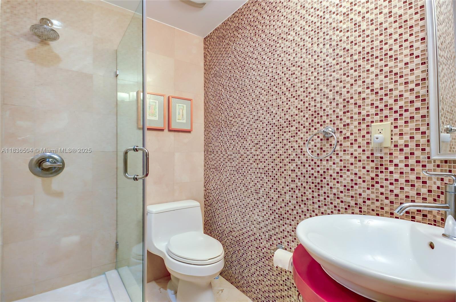 3131 Northeast 188th Street, Unit 1808 Aventura, FL 33180 - Photo 46 of 72 a bathroom with a sink toilet and shower