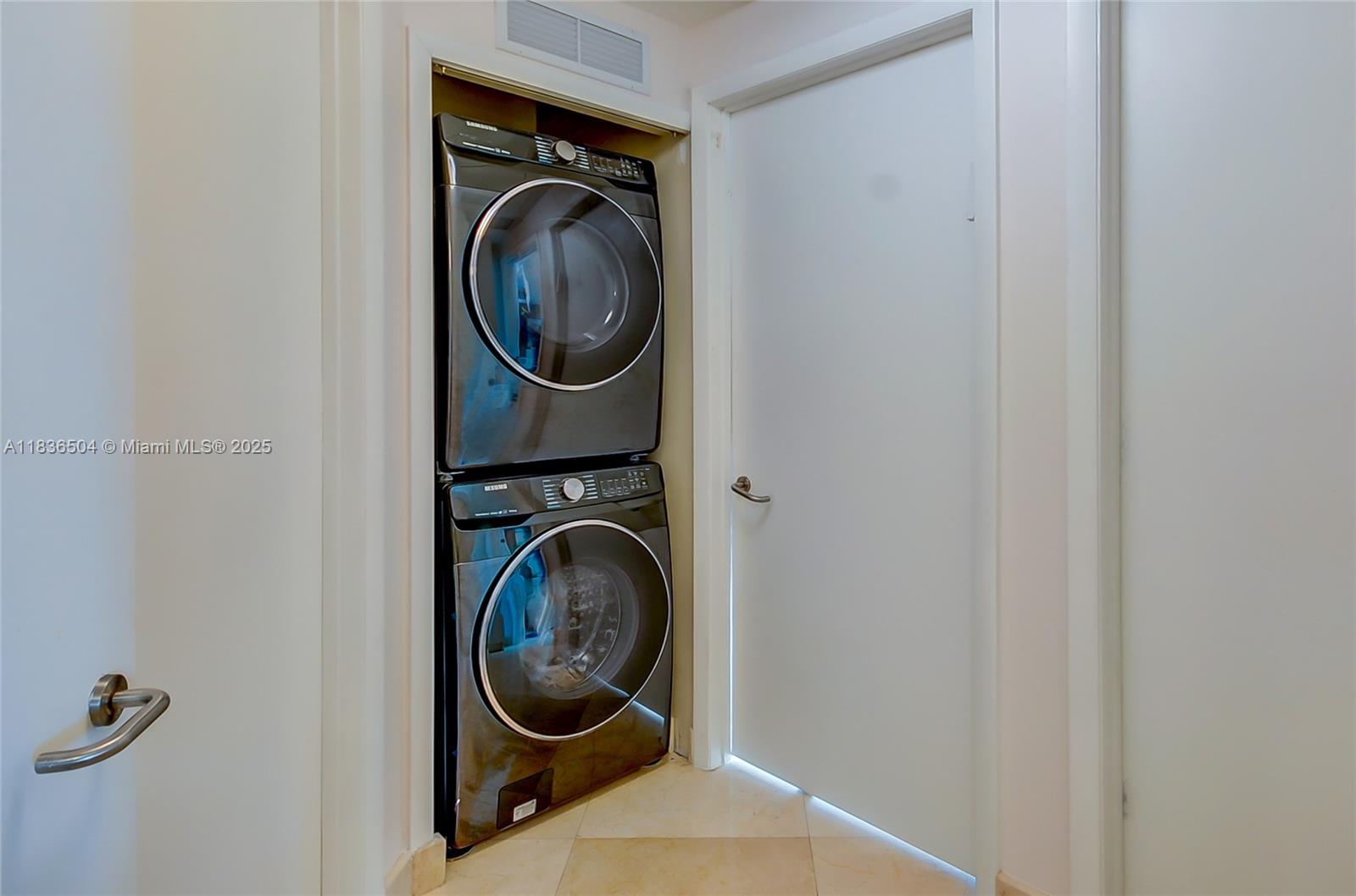 3131 Northeast 188th Street, Unit 1808 Aventura, FL 33180 - Photo 48 of 72 a utility room with dryer and washer