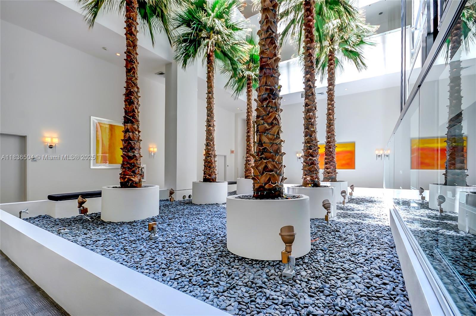 3131 Northeast 188th Street, Unit 1808 Aventura, FL 33180 - Photo 50 of 72 a living room with furniture and a potted plant