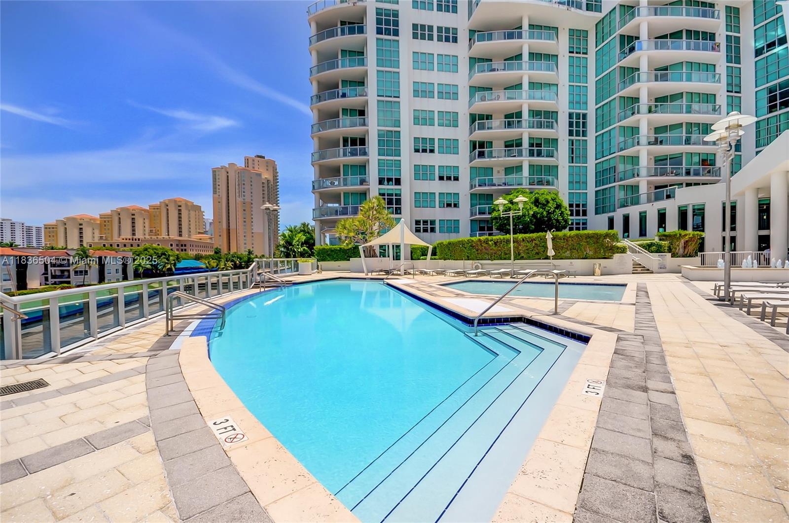 3131 Northeast 188th Street, Unit 1808 Aventura, FL 33180 - Photo 62 of 72 a view of swimming pool with outdoor seating and city view