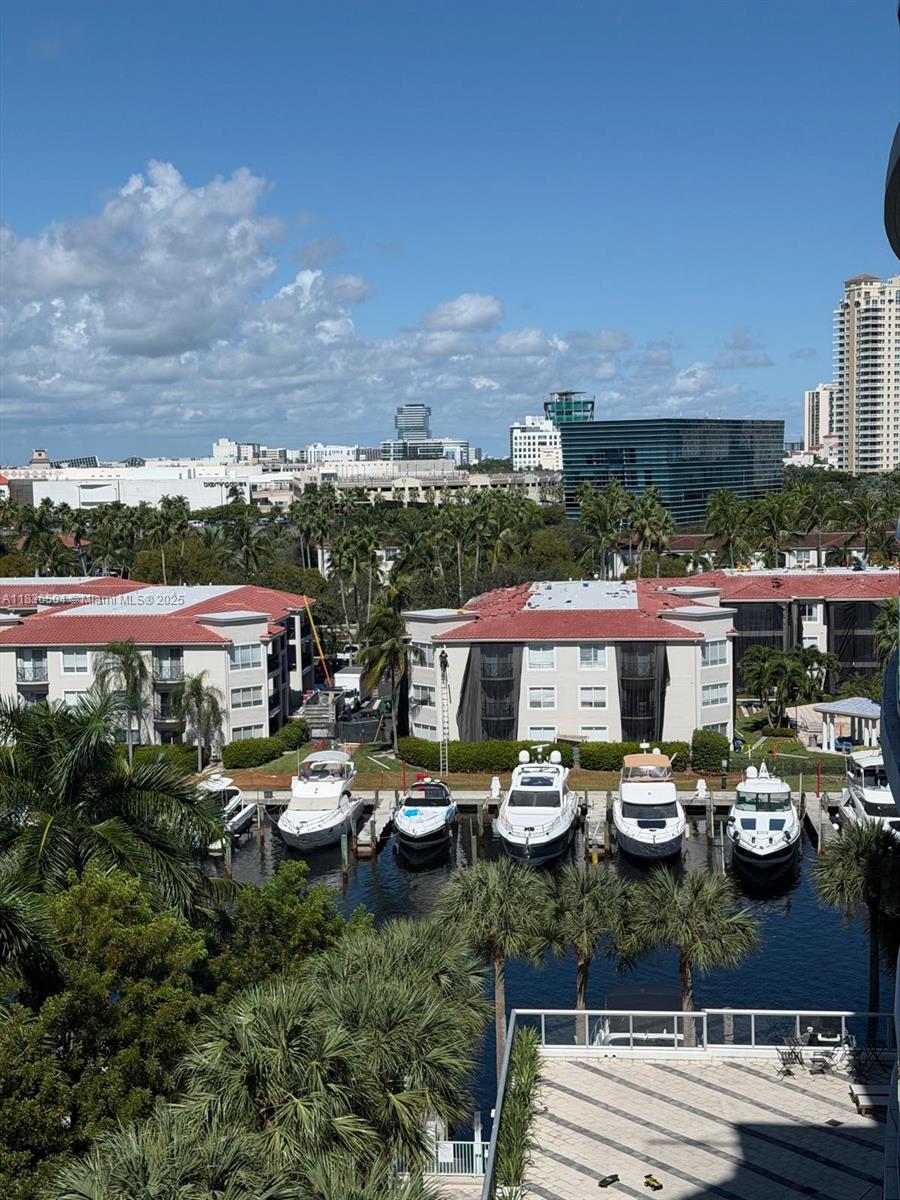 3131 Northeast 188th Street, Unit 1808 Aventura, FL 33180 - Photo 71 of 72 a view of a lake and a cars park side of the road