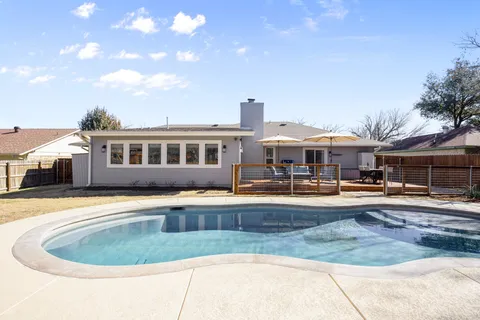a front view of houses with yard