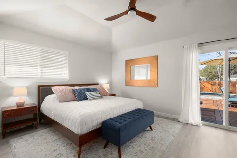 a bedroom with bed and a window