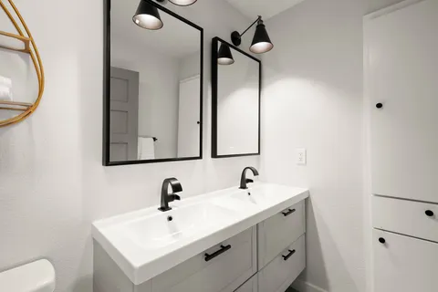 a bathroom with a sink and a mirror