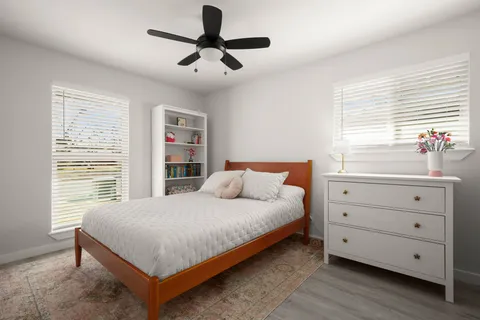 a bedroom with a large bed and a window