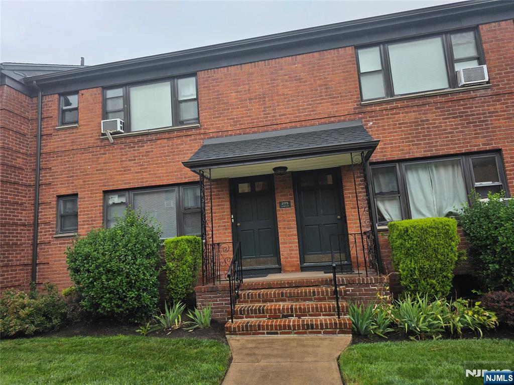 2175 North Central Road, Unit A Fort Lee, NJ 07024 - Photo 3 of 8 a view of a brick house with a large windows