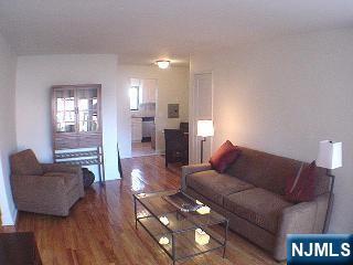 2175 North Central Road, Unit A Fort Lee, NJ 07024 - Photo 4 of 8 a living room with furniture and a wooden floor