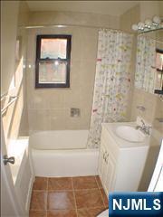 2175 North Central Road, Unit A Fort Lee, NJ 07024 - Photo 7 of 8 a bathroom with a bathtub and sink