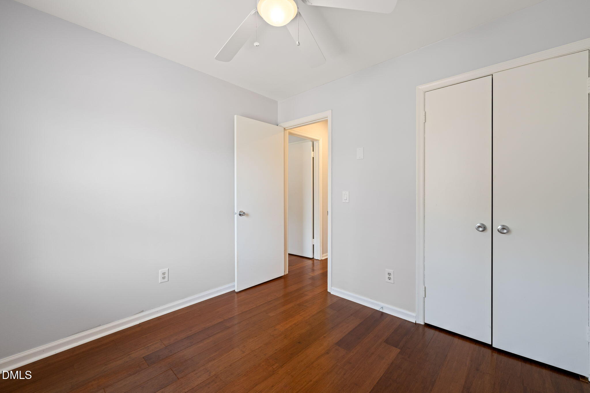1004 Woodhill Court Raleigh, NC 27615 - Photo 21 of 43 a view of an empty room with wooden floor