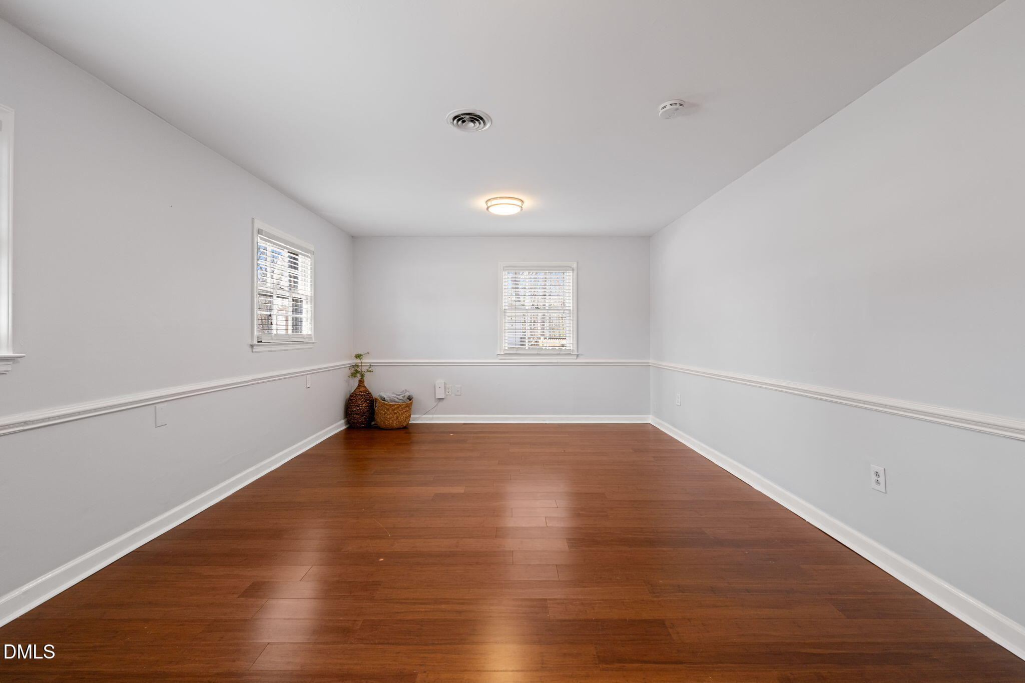 1004 Woodhill Court Raleigh, NC 27615 - Photo 26 of 43 an empty room with wooden floor and windows