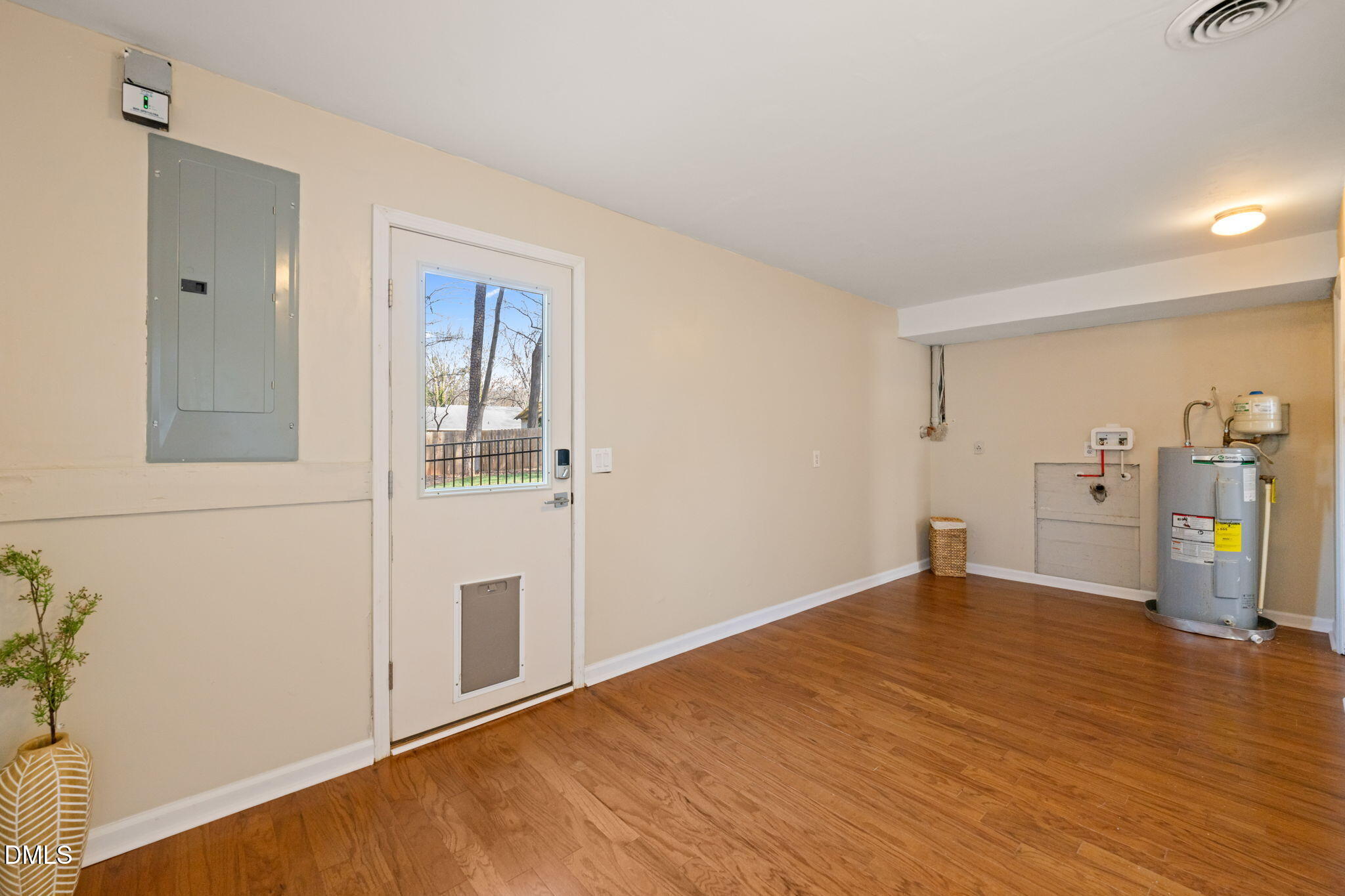 1004 Woodhill Court Raleigh, NC 27615 - Photo 30 of 43 a view of empty room with wooden floor and cabinet