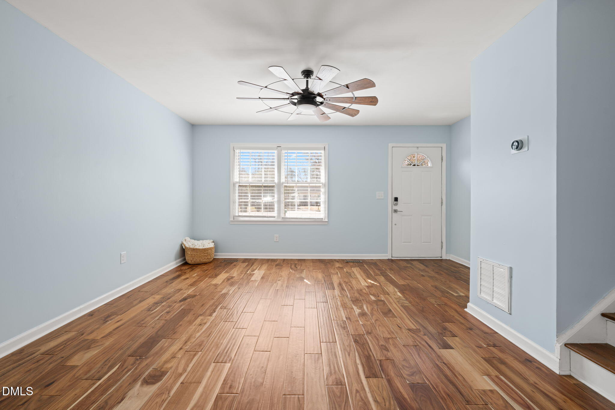 1004 Woodhill Court Raleigh, NC 27615 - Photo 3 of 43 wooden floor in an empty room with a window