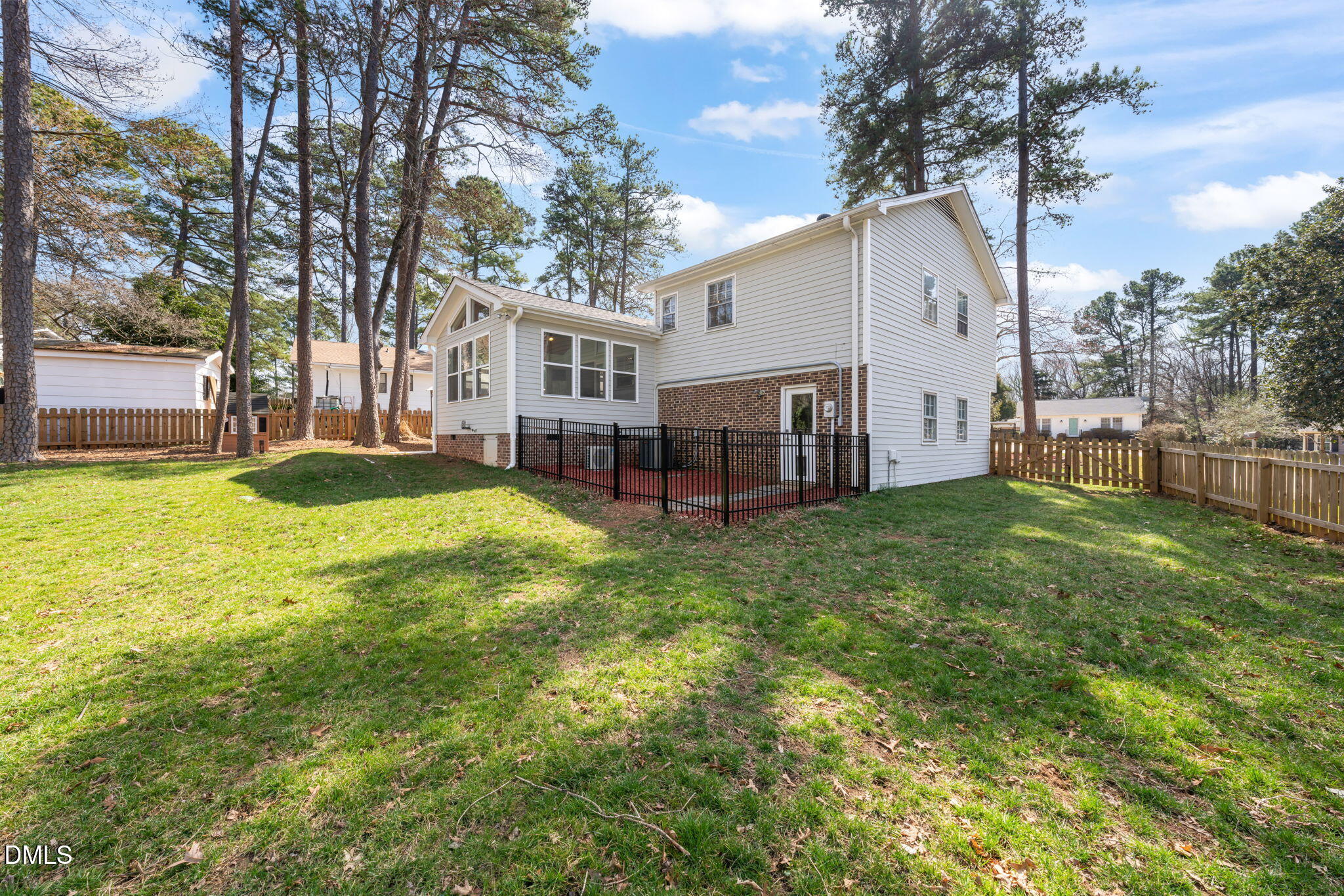 1004 Woodhill Court Raleigh, NC 27615 - Photo 33 of 43 a view of a house with a big yard and large tree