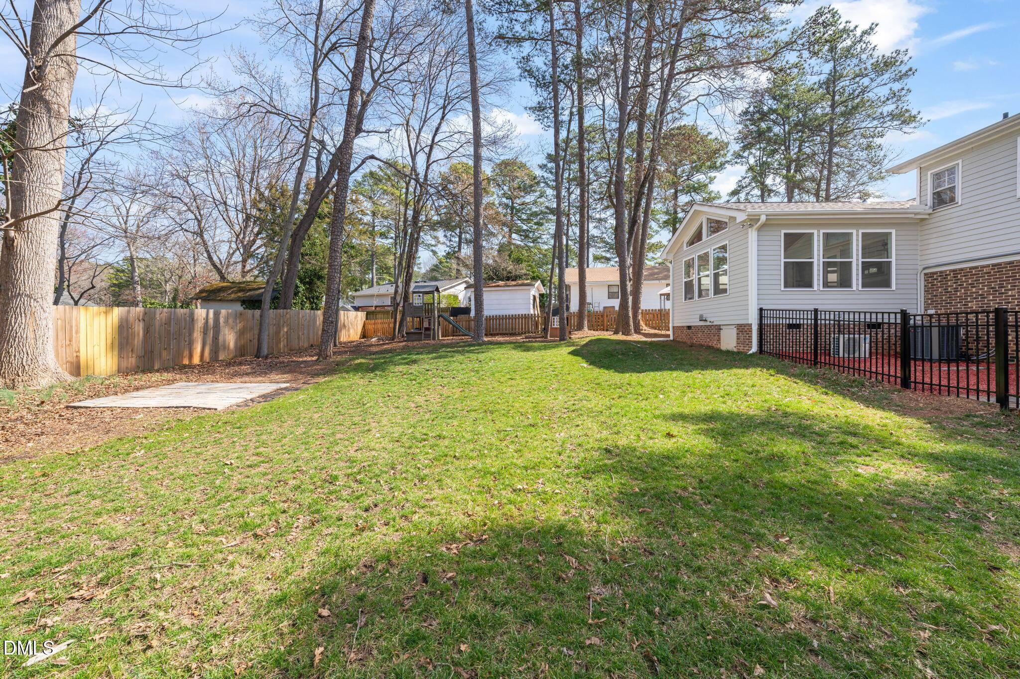1004 Woodhill Court Raleigh, NC 27615 - Photo 34 of 43 a swimming pool with outdoor seating and a garden