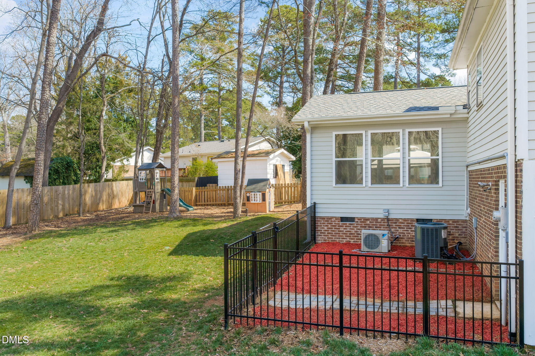 1004 Woodhill Court Raleigh, NC 27615 - Photo 38 of 43 a view of a house with backyard and sitting area