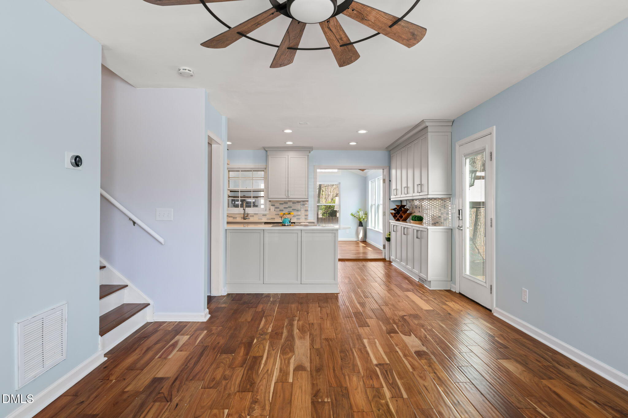 1004 Woodhill Court Raleigh, NC 27615 - Photo 5 of 43 a view of a kitchen with wooden floor and electronic appliances