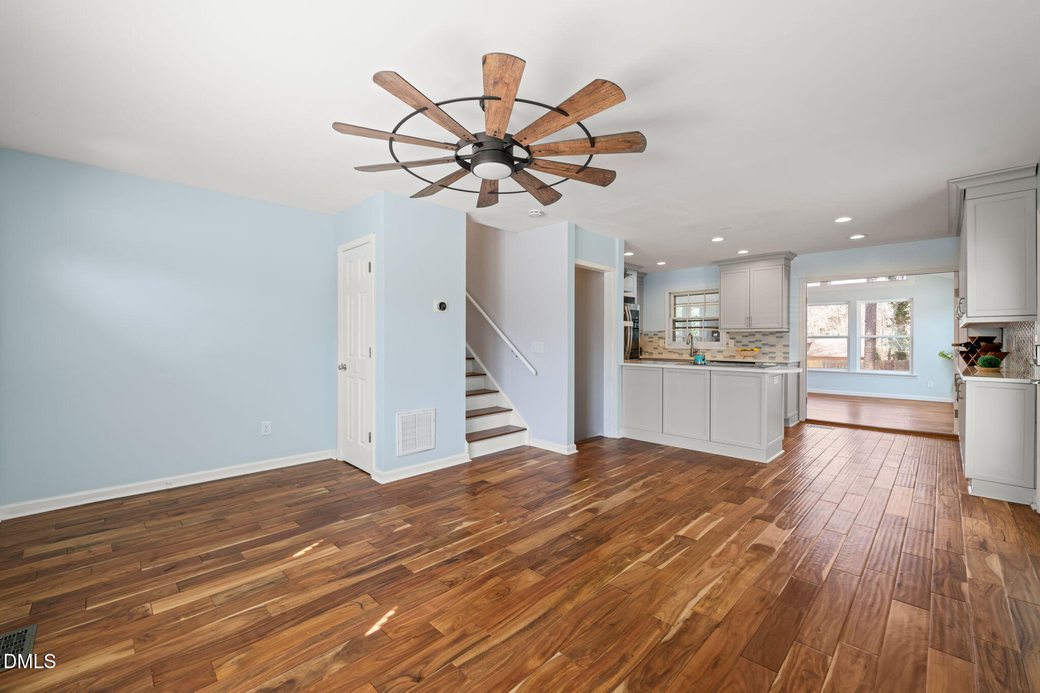 1004 Woodhill Court Raleigh, NC 27615 - Photo 6 of 43 a view of a kitchen with wooden floor and a sink