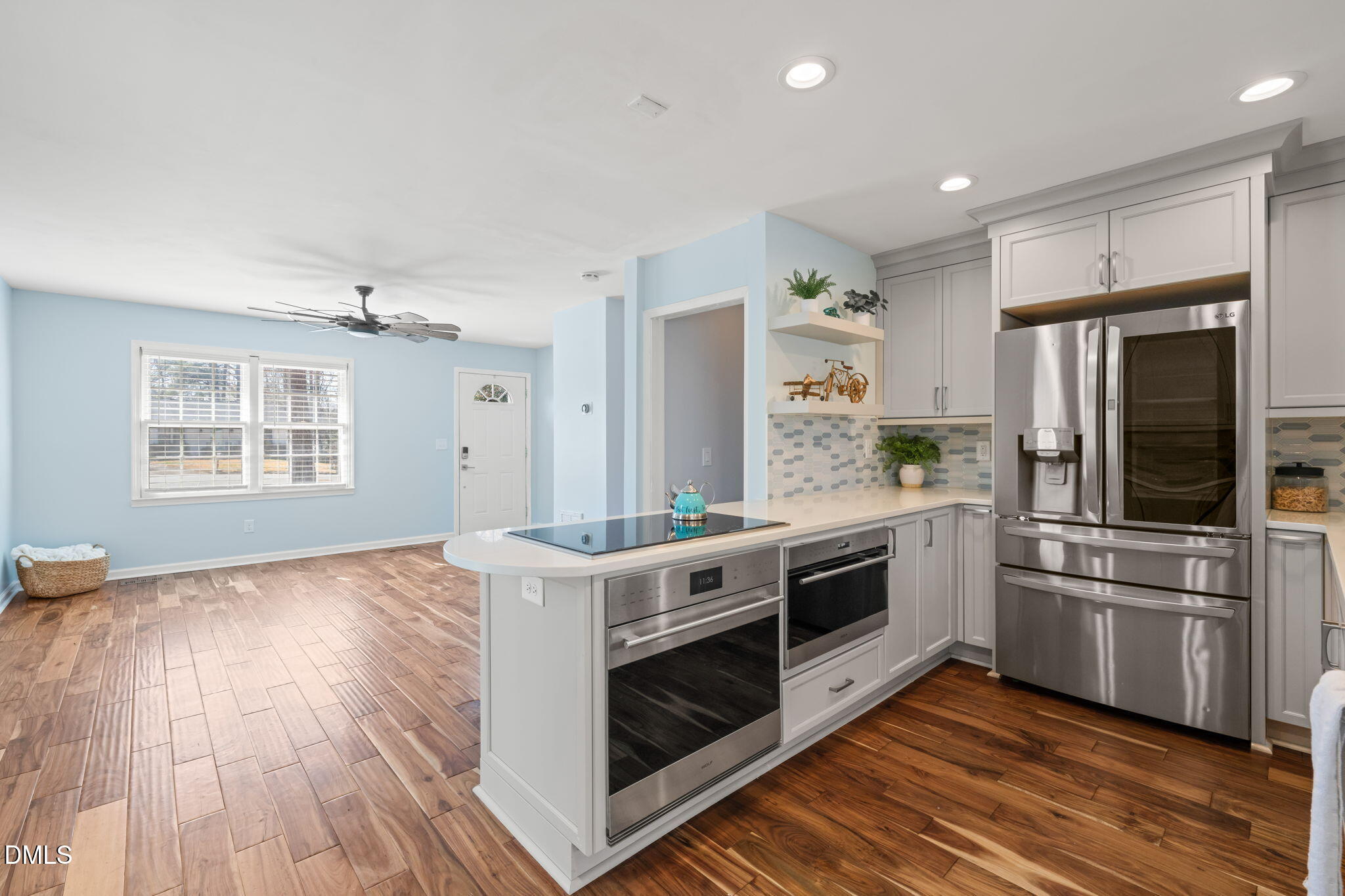 1004 Woodhill Court Raleigh, NC 27615 - Photo 10 of 43 a kitchen with stainless steel appliances a stove a sink and a refrigerator
