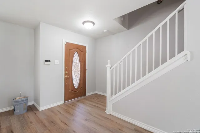 a view of entryway with wooden floor