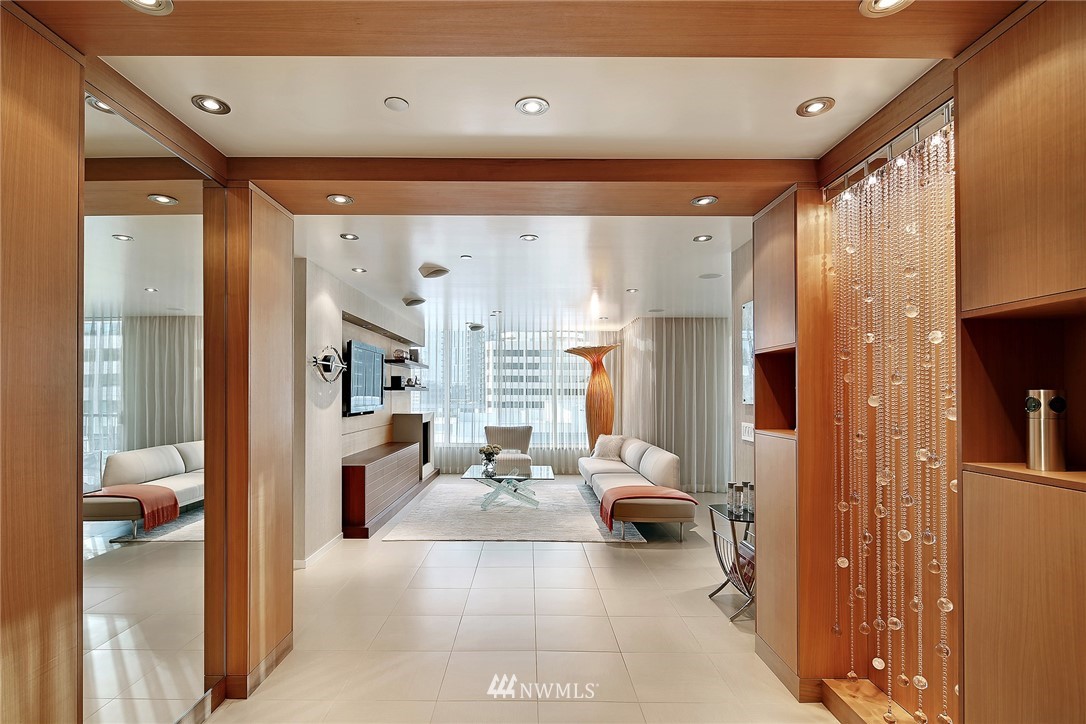 a living room with furniture and a large window